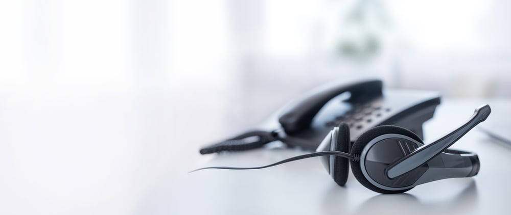 A VOIP headset on a contact center table