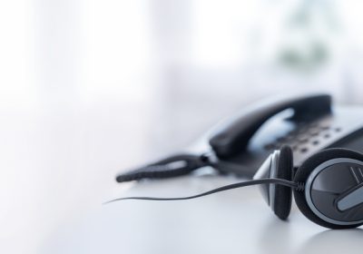 A VOIP headset on a contact center table