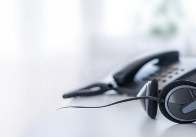 A VOIP headset on a contact center table