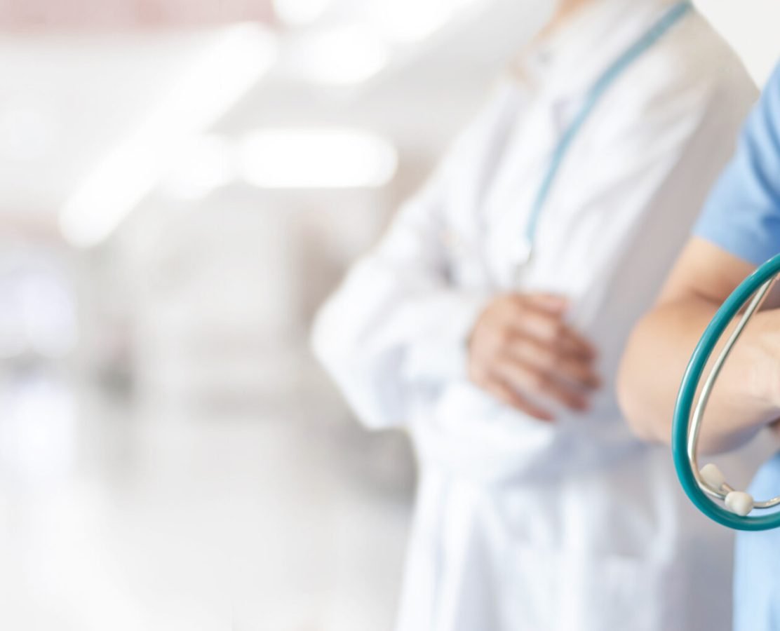 Surgeon and anesthetist doctor ER team with medical clinic room background for emergency nursing care professional teamwork and patient trust in hospital's hospitality concept