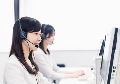 A woman talking to a customer at a call center